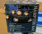 Hampton Bay 10 Ft. Black Plug-in String Light W/ Smoky Glass Shades & Bulbs New. Price: $25.00.