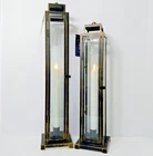 Home Reflections Indoor/outdoor Slim Taper Lanterns Brass 20"H & 17-3/8"H SET/2 Open. Price: $74.95.