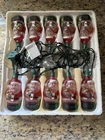 Holiday Time 10 Santas Indoor Glass Light Set Connects At One End Used. Price: $18.95.