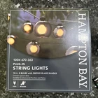 Hampton Bay 10 Ft. Black Plug-in String Light W/ Smoky Glass Shades & Bulbs New. Price: $19.95.