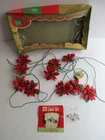 Santa World Kurt Adler 10 Miniature Italian Plastic Poinsettia String Lights Used. Price: $19.99.