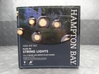 Hampton Bay 8-LIGHT 10 Ft. Black In/outdoor Plug-in String W/ Smoky Glass Open. Price: $12.99.